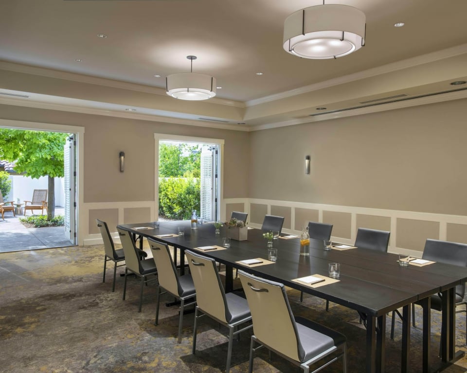 Magnolia Meeting room set conference style with doors open