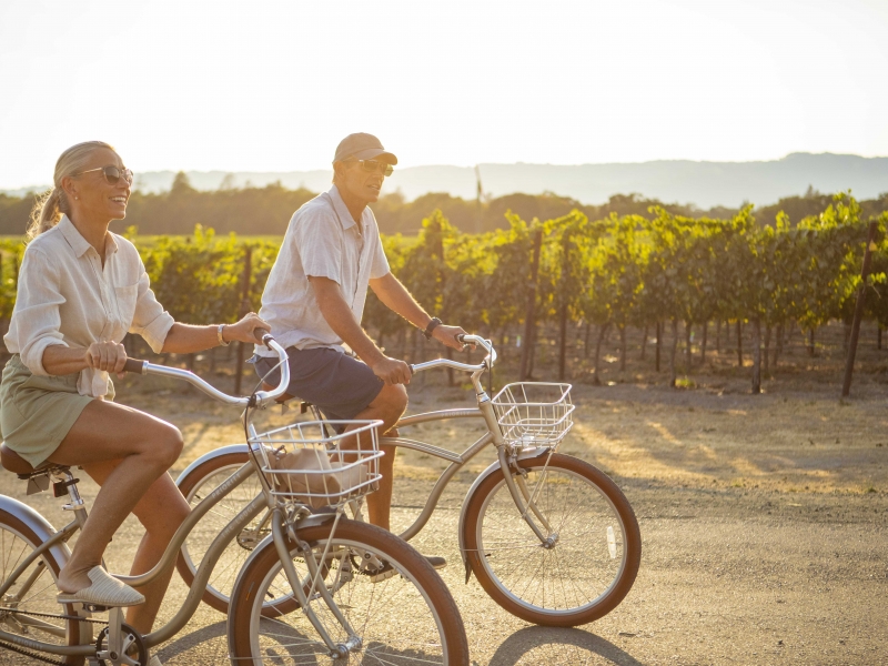 Weekenders biking in vineyard close up