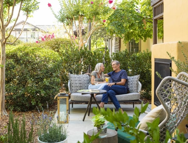 Weekenders on Cottage Jr Suite patio with outdoor fireplace