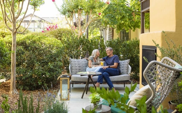 Weekenders on Cottage Jr Suite patio with outdoor fireplace