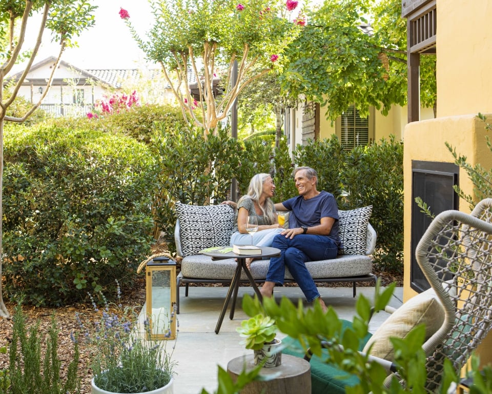 Weekenders on Cottage Jr Suite patio with outdoor fireplace
