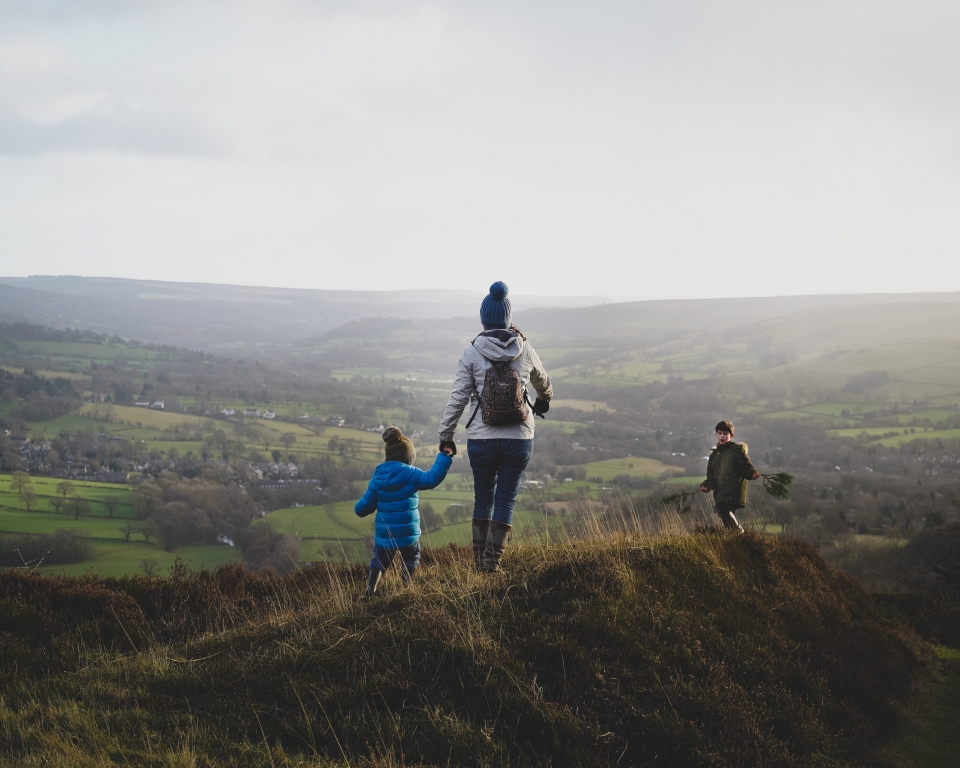 Mother hiking with children