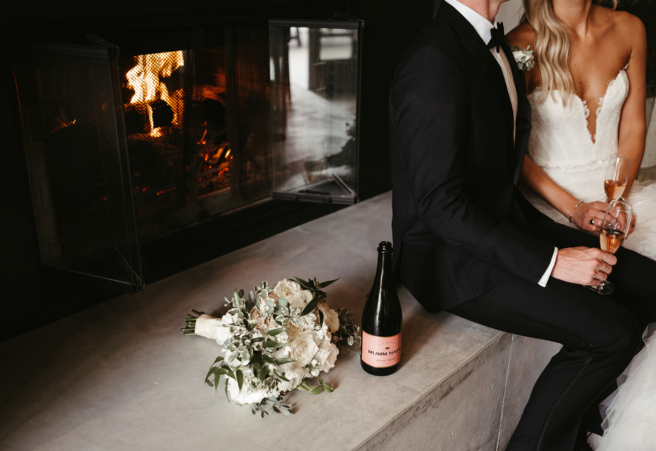 Married couple sitting with champagne